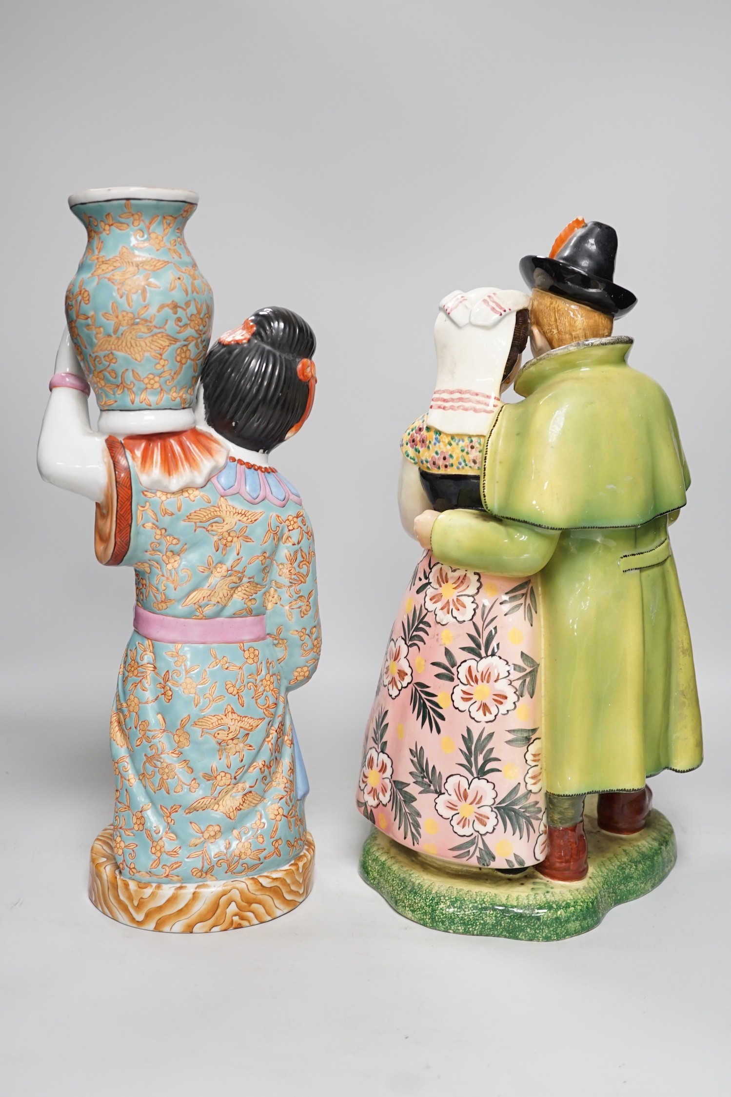 A Chinese porcelain figure of a lady together with a continental porcelain figure group, tallest 38cm